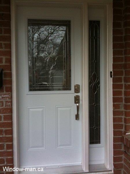 Front door with sidelight installation. Half glass and full sidelight. Plymouth stained glass catalog. Beveled Glass zinc caming. Professional renovation contractor
